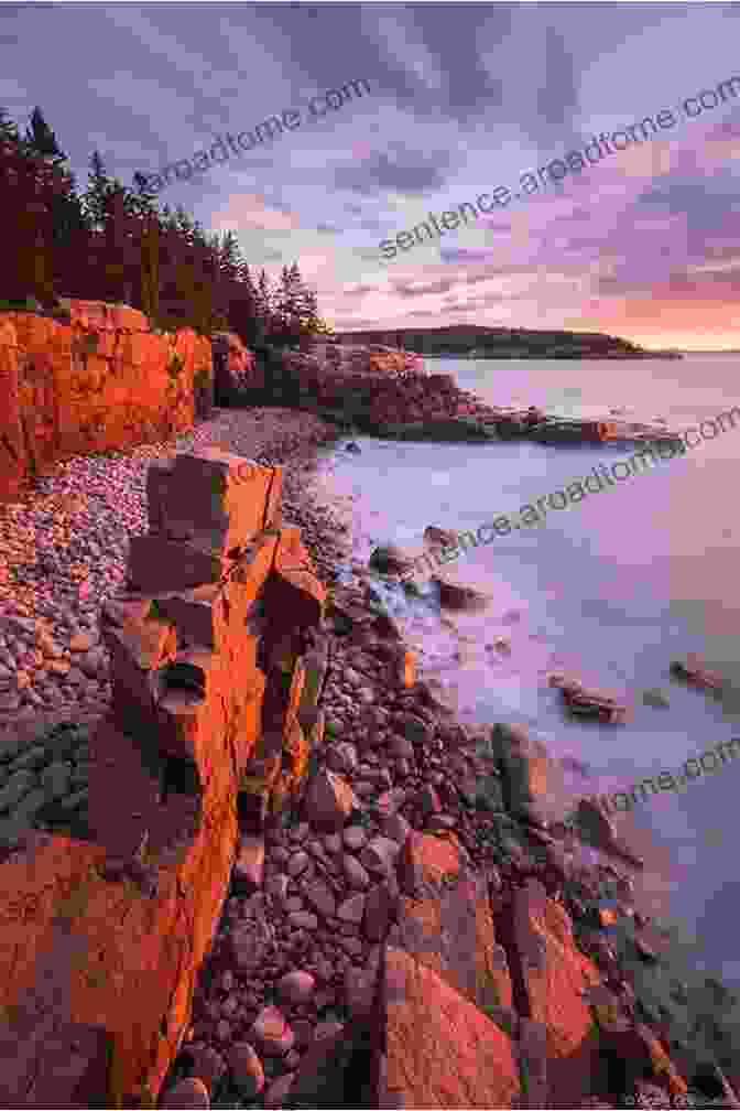 A Breathtaking Sunrise Over Acadia National Park's Coastline, Casting A Warm Glow On The Granite Cliffs And Tranquil Waters. The Sacred Shore (Song Of Acadia #2)