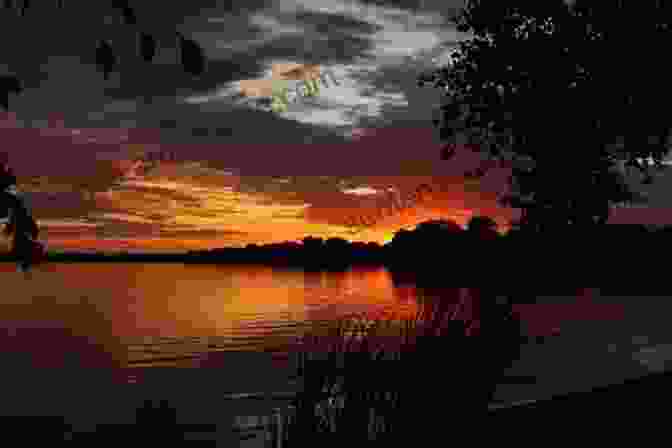 A Tranquil Sunset Reflection On A Lake Gardentry: Poems And Such Kat Way