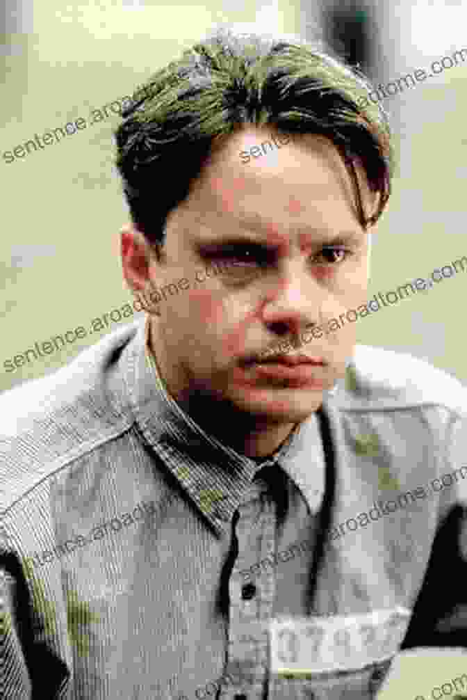 Close Up Of Tim Robbins As Andy Dufresne, Looking Determined And Hopeful Behind Prison Bars. The Shawshank Redemption Revealed: How One Story Keeps Hope Alive