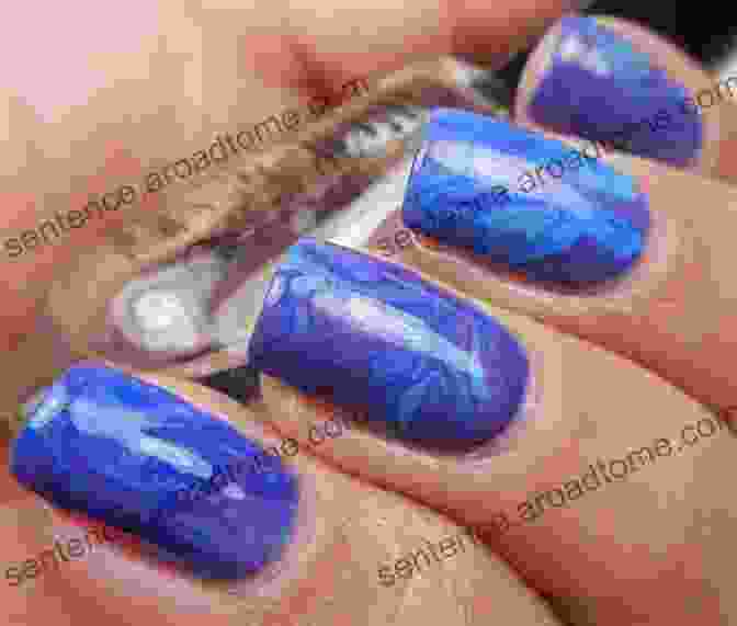 Marbled Nail Art With Swirls Of Blue, Pink, And White Nail Polish DIY Nail Art: Easy Step By Step Instructions For Creative Nail Art Designs: A Beginners Guide To Basic Nail Art Designs Easy