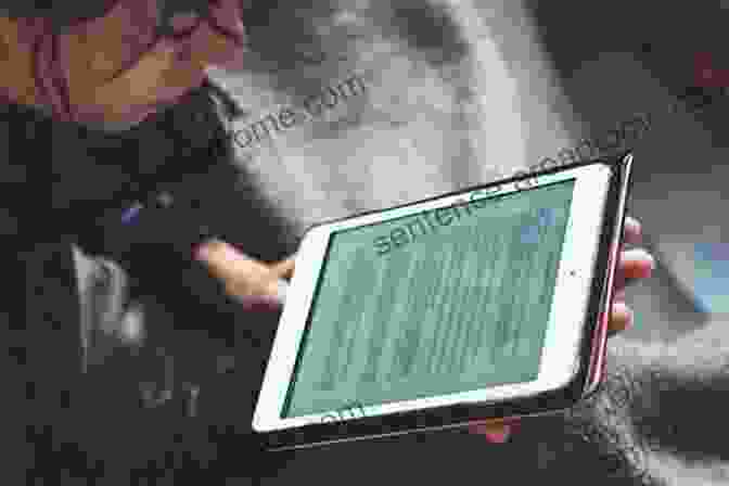 Person Reading An E Book On A Tablet Burning The Page: The EBook Revolution And The Future Of Reading