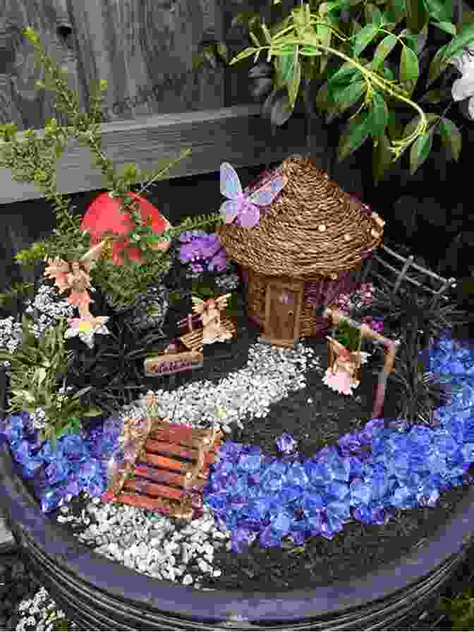 Woman Planning A Fairy Garden On A Table With Miniature Houses And Plants Fairy Gardening: Creating Your Own Magical Miniature Garden